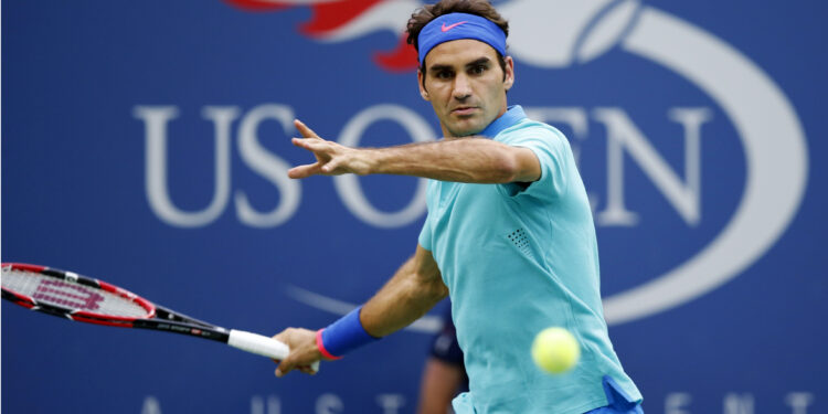 Roger Federer, of Switzerland, returns a shot against Marcel Granollers, of Spain, during the third round of the 2014 U.S. Open tennis tournament, Sunday, Aug. 31, 2014, in New York. (AP Photo/Kathy Willens)