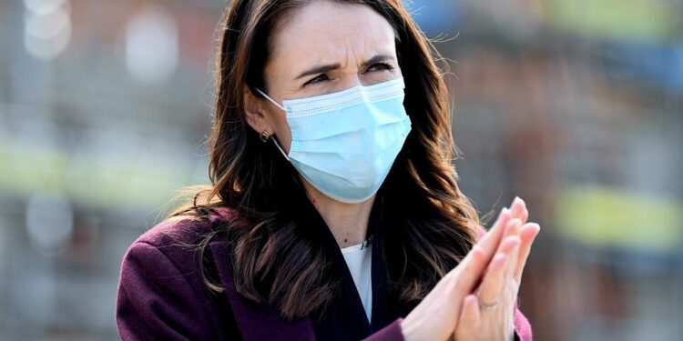 AUCKLAND, NEW ZEALAND - AUGUST 31: New Zealand Prime Minister Jacinda Ardern wears a mask when answering questions from the media after visiting the Kainga Ora housing development on August 31, 2020 in Auckland, New Zealand. Face coverings are now compulsory for all New Zealanders over the age of 12 on public transport or planes under current Alert Level restrictions in place across the country. Auckland is currently at Alert Level 2.5 while the rest of New Zealand is at Alert Level 2. (Photo by Hannah Peters/Getty Images)