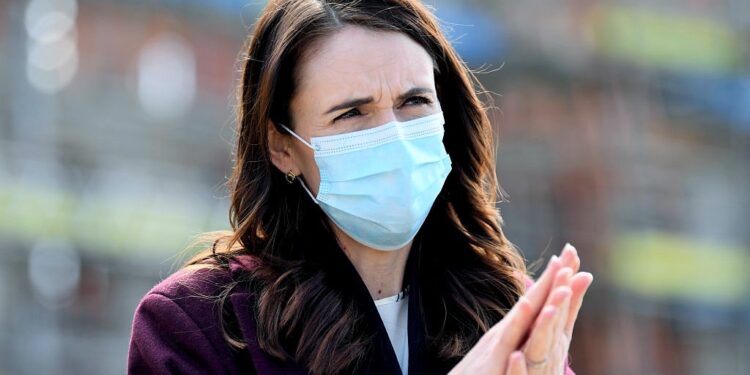 AUCKLAND, NEW ZEALAND - AUGUST 31: New Zealand Prime Minister Jacinda Ardern wears a mask when answering questions from the media after visiting the Kainga Ora housing development on August 31, 2020 in Auckland, New Zealand. Face coverings are now compulsory for all New Zealanders over the age of 12 on public transport or planes under current Alert Level restrictions in place across the country. Auckland is currently at Alert Level 2.5 while the rest of New Zealand is at Alert Level 2. (Photo by Hannah Peters/Getty Images)