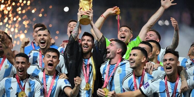 Argentina's forward #10 Lionel Messi lifts the World Cup trophy during the Qatar 2022 World Cup trophy ceremony after the football final match between Argentina and France at Lusail Stadium in Lusail, north of Doha on December 18, 2022. - Argentina won in the penalty shoot-out. (Photo by FRANCK FIFE / AFP)