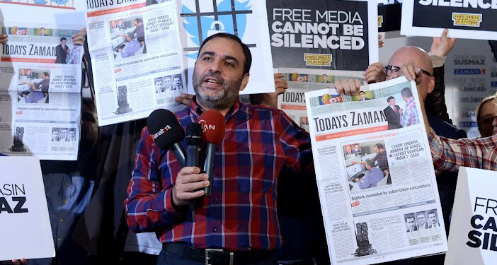 Today's Zaman Editor-in-Chief Bulent Kenes was taken from his office and arrested on charges of insulting President Recep Tayyip Erdogan in a series of tweets that the journalist said was simply him expressing a critical opinion.