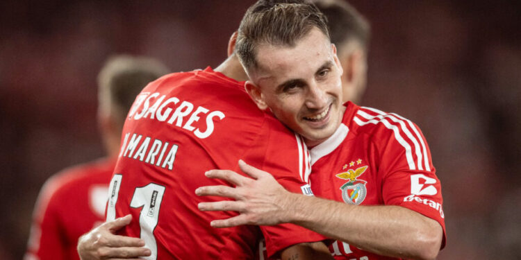 Benfica's Argentine forward #11 Angel Di Maria celebrates scoring a goal, with Benfica's Turkish forward #17 Kerem Akturkoglu, during the Spanish league football match between Real Sociedad and Real Madrid CF at the Anoeta stadium in San Sebastian on September 14, 2024. (Photo by Patricia DE MELO MOREIRA / AFP)