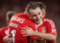 Benfica's Argentine forward #11 Angel Di Maria celebrates scoring a goal, with Benfica's Turkish forward #17 Kerem Akturkoglu, during the Spanish league football match between Real Sociedad and Real Madrid CF at the Anoeta stadium in San Sebastian on September 14, 2024. (Photo by Patricia DE MELO MOREIRA / AFP)