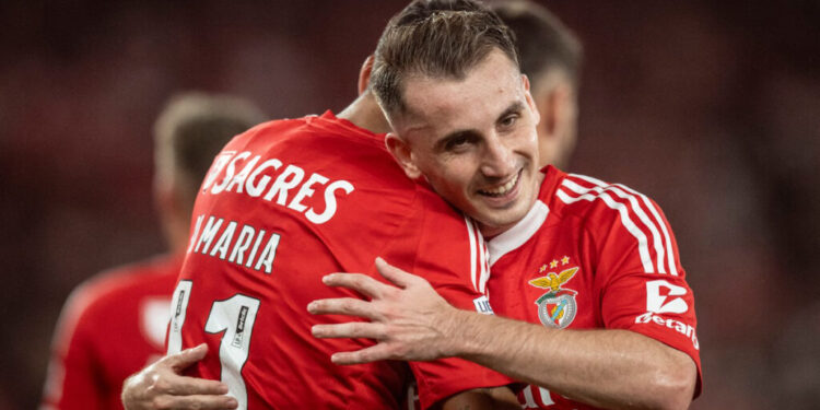 Benfica's Argentine forward #11 Angel Di Maria celebrates scoring a goal, with Benfica's Turkish forward #17 Kerem Akturkoglu, during the Spanish league football match between Real Sociedad and Real Madrid CF at the Anoeta stadium in San Sebastian on September 14, 2024. (Photo by Patricia DE MELO MOREIRA / AFP)