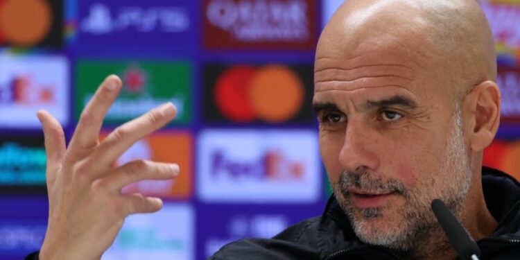 Manchester City's Spanish head coach Pep Guardiola gives a press conference on the eve of the UEFA Champions League league phase day 6 football match between Real Madrid CF and Manchester City at Santiago Bernabeu Stadium in Madrid on December 9, 2025. (Photo by Thomas COEX / AFP)