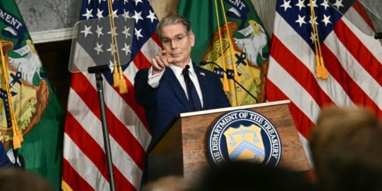 US Secretary of the Treasury Scott Bessent takes questions from reporters as he speaks during a press conference in Washington, DC on August 24, 2026. Bessent, in a column for the Financial Times, declared that an "economic D-Day" had begun against Tehran on Monday and said any country that continued to enable the Islamic republic would become a "global pariah." (Photo by Kent NISHIMURA / AFP)